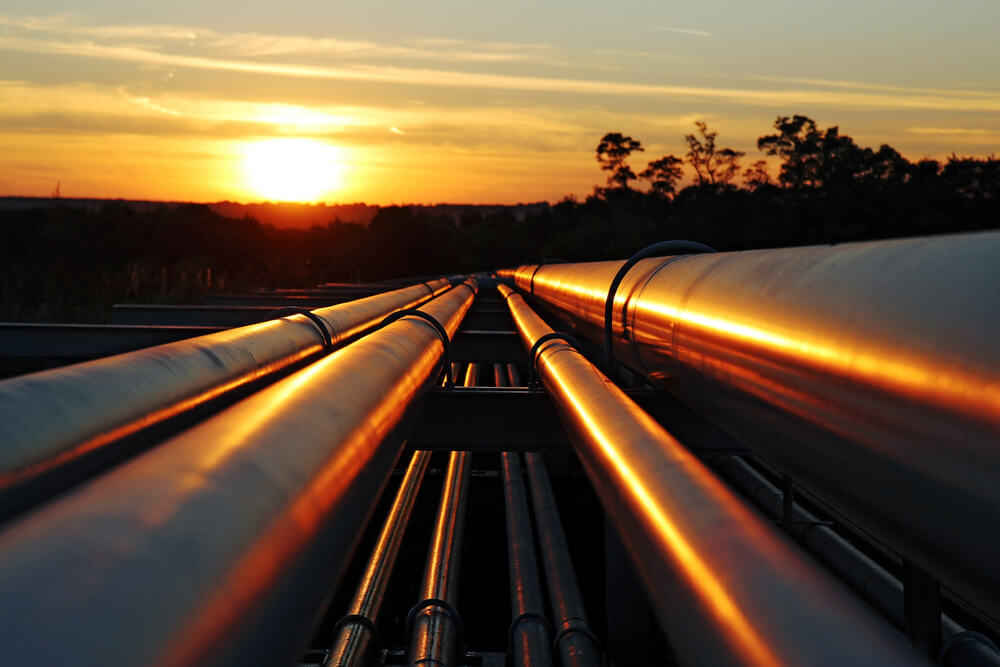 Oil pipeline against the sunset